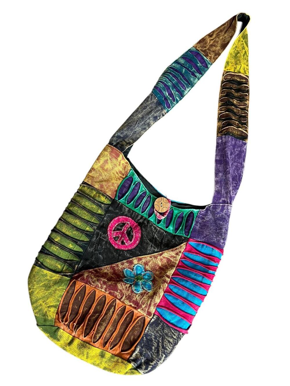 Hobo style shoulder bag with razor cut designs